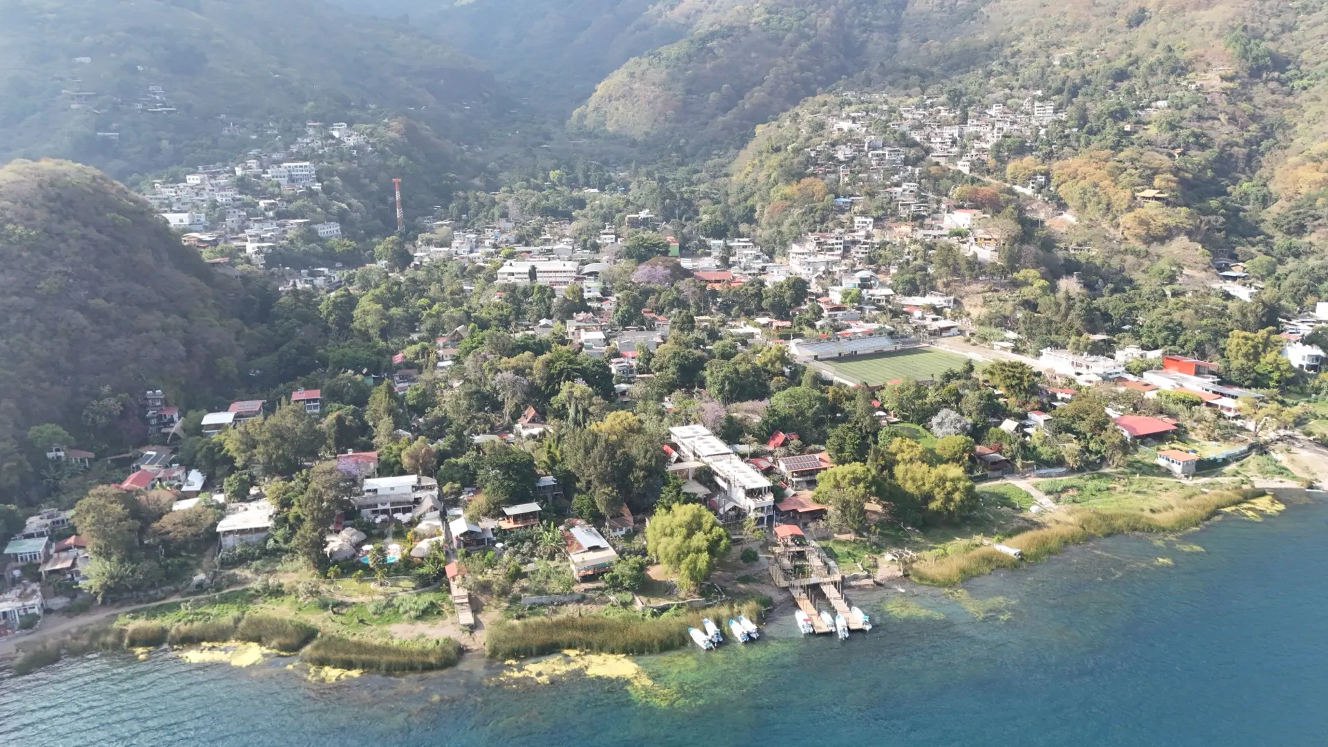 Wide aerial view of San Marcos La Laguna and the surrounding hills at Lake Atitlán